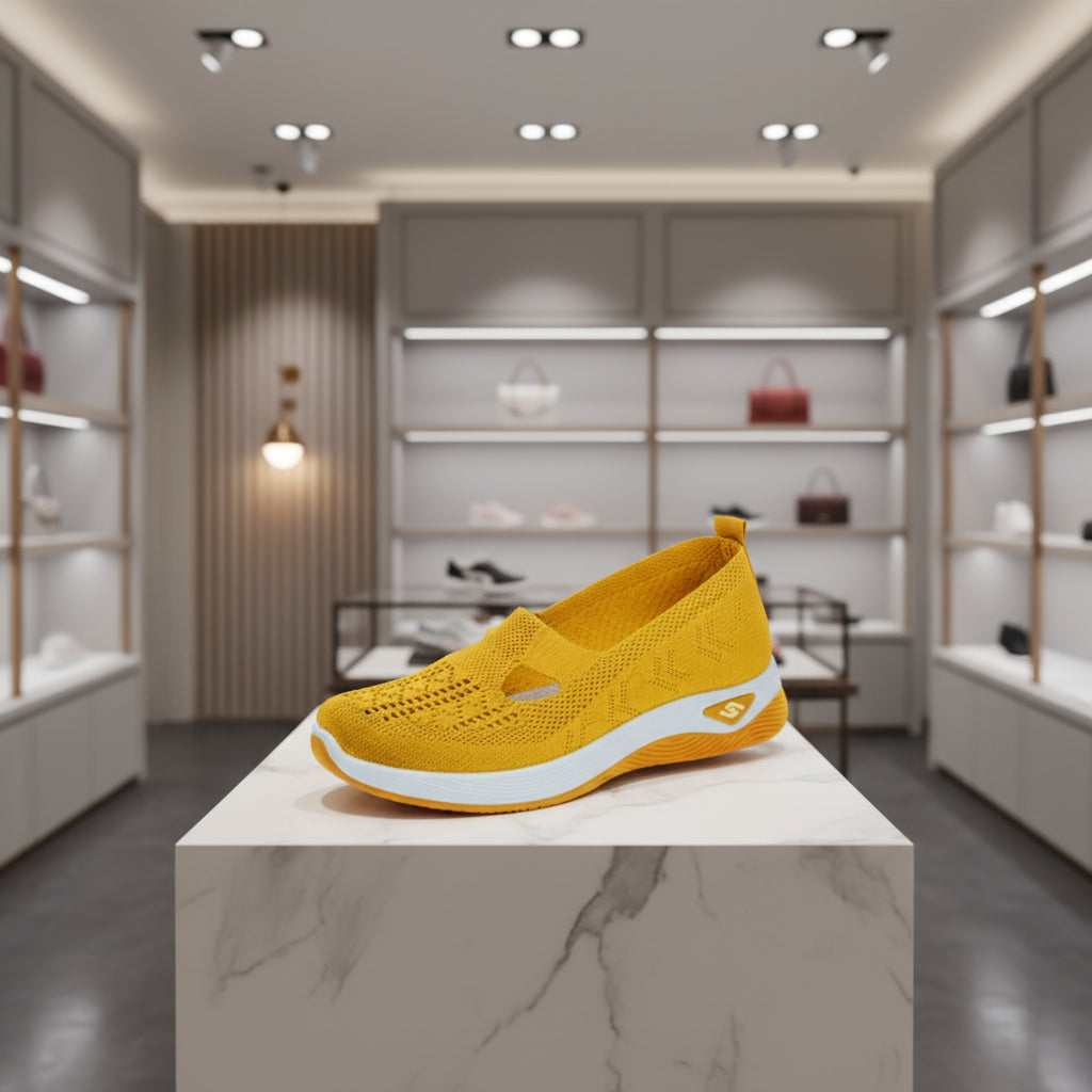Détail du mesh aéré des sneakers femme, matière respirante et légère.jaune